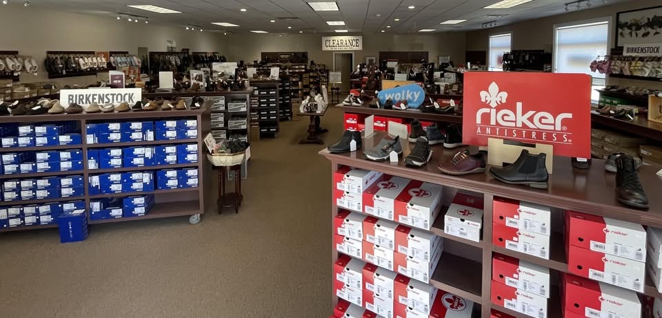 Inside Clinton Bootery, with displays of shoes and shelves of Birkenstock and Rieker boxes